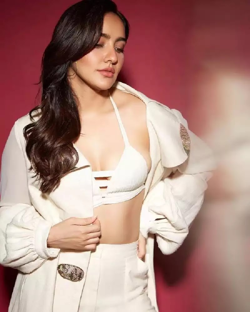 neha sharma white top cleavage