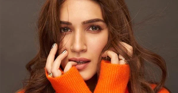 Kriti Sanon in a cozy orange sweater looks stunning hot.