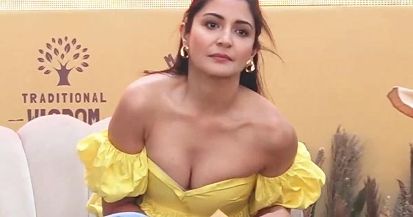Anushka Sharma wardrobe malfunction – shows her bra in cleavage baring tiny yellow top.