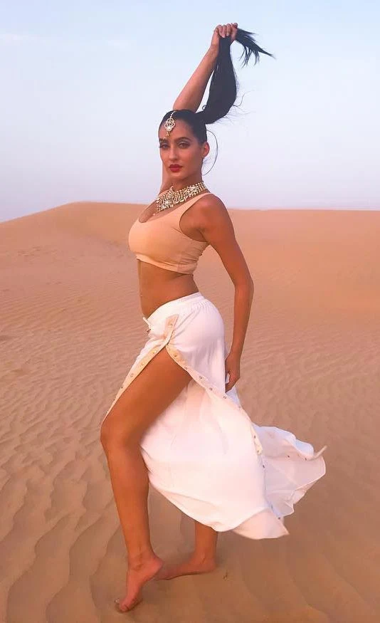 nora fatehi legs thighs risky high slit dress