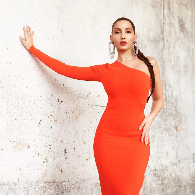 Nora Faehi tight orange dress curvy body