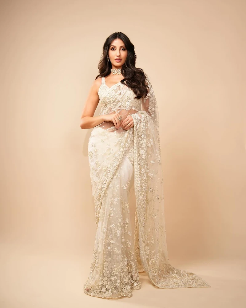 nora fatehi white saree cleavage curvy bollywood actress