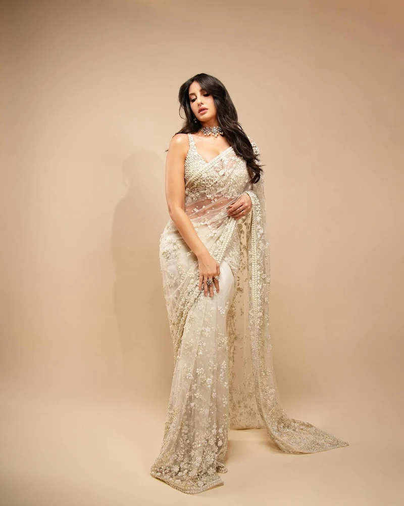 nora fatehi white saree cleavage curvy bollywood actress