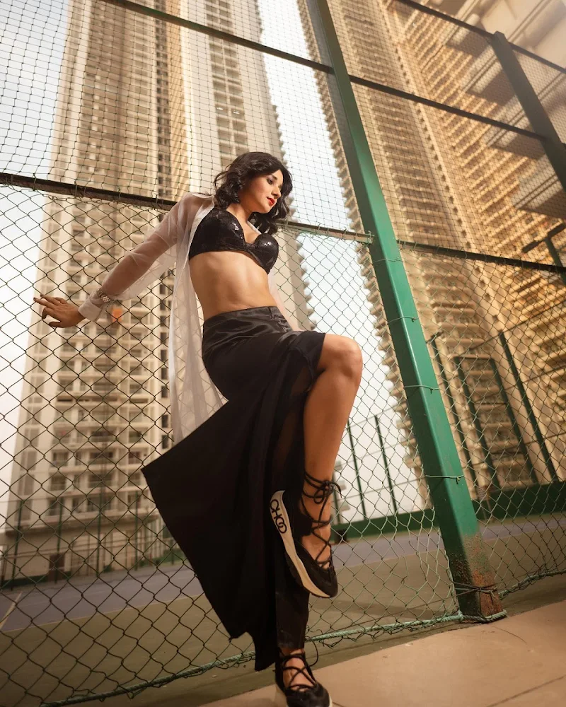 Kanika Mann legs black tiny top skirt