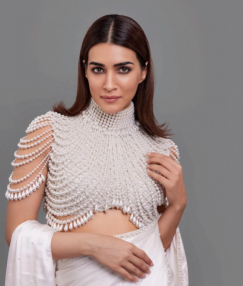 Kriti Sanon sexy face pearl blouse white saree