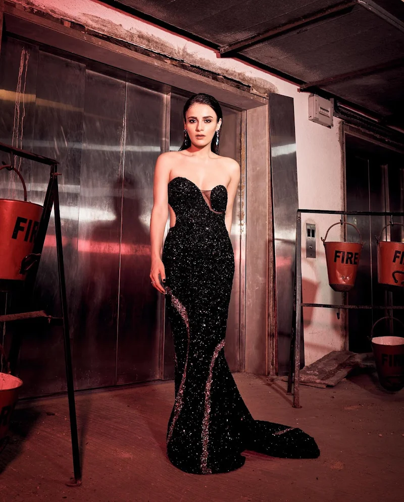 radhika madan off shoulder black backless dress radhika madan off shoulder black backless dress