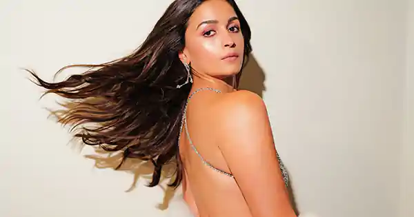 Alia Bhatt in backless shimmery silver dress flaunted her sexy back at BAFTA awards.