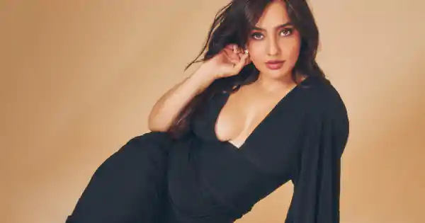 Neha Sharma in deep neckline black dress made the temperature rise.