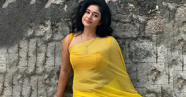 poonam bajwa sheer yellow saree sleeveless blouse
